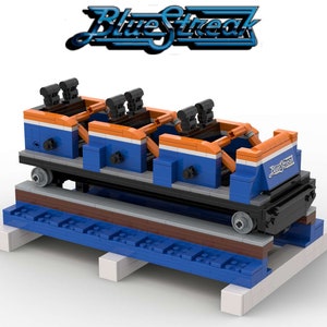 May include: A blue and orange Lego roller coaster train with the words "Blue Streak" on the back. The train is on a track made of Lego bricks.