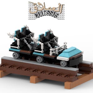 May include: A miniature roller coaster model made of colorful blocks. The coaster features a teal car with black and white accents, and a track made of brown blocks. The sign above the coaster says "COLOSSUS".