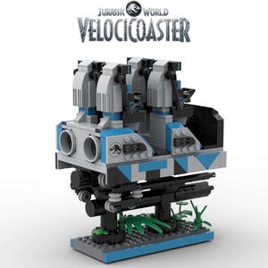 May include: A Lego Jurassic World VelociCoaster ride set with a blue, black, and white color scheme. The ride features a dinosaur logo and a track with a base.