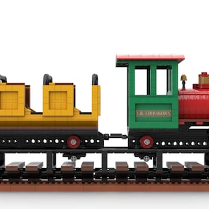 May include: A red, green, and yellow toy train with a black engine and three yellow passenger cars. The train is on a brown track and the engine has the text "C.R. COURAGEOUS" on the side.