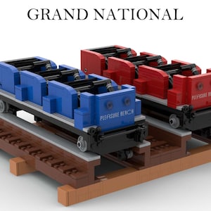 May include: Two miniature roller coaster trains, one blue and one red, with the words "Pleasure Beach" on the front. The trains are on a wooden track and are ready to ride.