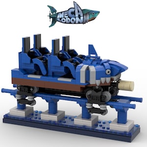 Könnte beinhalten: Ein blaues und weißes Lego-Modell einer Hai-Themen-Achterbahn. Die Achterbahn hat vier Sitze und einen Hai-Kopf vorne. Die Achterbahn befindet sich auf einer Schiene und hat eine blaue Basis. Der Text "MECHA LODON" befindet sich auf dem Hai-Kopf.