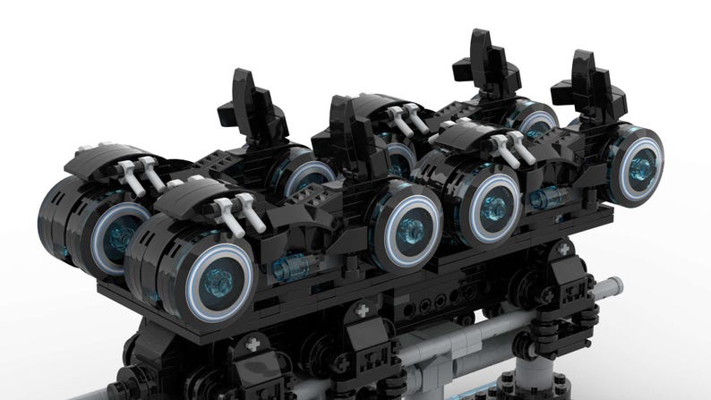 May include: A black Lego model of a futuristic vehicle with four wheels and a detailed design. The vehicle has a sleek, aerodynamic shape and features glowing blue lights on the wheels.