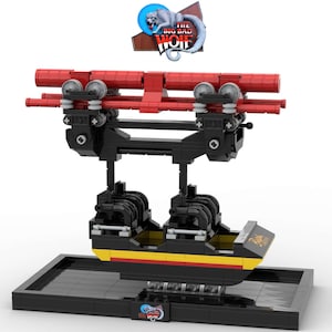 May include: A model roller coaster in black and red, with yellow and black detailing. The model features the text "The Big Bad Wolf" and "Ride". The roller coaster is mounted on a black base, with a logo featuring a wolf.