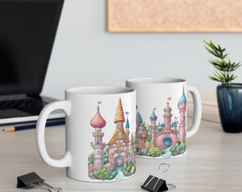 May include: Two white ceramic mugs with a colorful illustration of a fairytale castle on each. The castle is pink, yellow, and blue with green trees and a blue river.