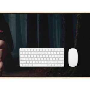 May include: A figure in a red hooded cloak walks through a dark forest. The figure is walking away from the camera. The background is a dark forest with trees and shadows.