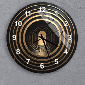 May include: Round wall clock with a black marble-look face and gold concentric circles. White numerals mark the hours. The clock face features an artistic tunnel design. The clock hands are black.