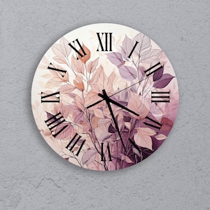 May include: Round wall clock with a floral design. The clock face features Roman numerals and black clock hands. The background is a soft cream color with a botanical illustration in shades of purple, pink, and orange.