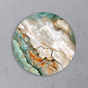 May include: Circular wall clock with a marbled effect in teal, white, orange, and gold. The clock face has gold numerals and hands. A decorative and functional item for home decor, measuring approximately 30 cm in diameter.
