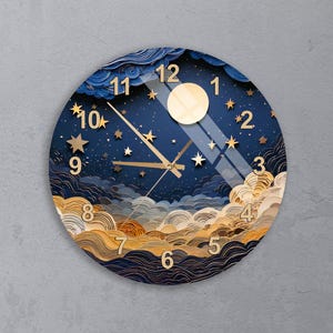 May include: A circular wall clock featuring a deep blue night sky design with layered clouds in shades of navy, cream, and gold. The clock face displays a large pale yellow moon, gold stars, and gold numerals from 1 to 12 with gold clock hands.