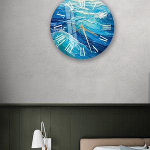 a bedroom with a bed and a clock on the wall