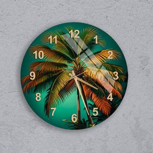 May include: Round wall clock featuring a vibrant palm tree design. The clock face is a deep teal color with gold-colored numerals and hands. The palm tree image has shades of green, orange, and yellow.