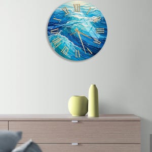 a clock on a wall above a dresser