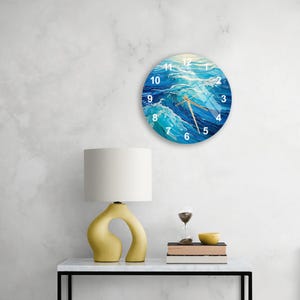 a table with a lamp and a clock on it