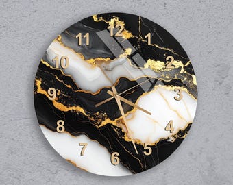 May include: Round wall clock with a black, white, and gold marble design. The clock face features gold numerals and hands, creating a luxurious aesthetic. The clock is mounted on a gray wall.