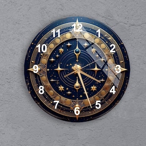 May include: A round wall clock with a dark blue face and gold accents. The clock features white numerals, gold hands, and star-shaped designs. The clock's face has a glass cover.