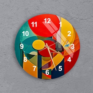 May include: A round clock with a colourful abstract design. The clock face features a red, yellow, blue, and green geometric pattern with black outlines. The numbers 1 through 12 are printed in white around the edge of the clock face.