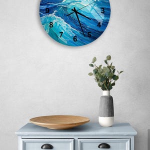 a clock on a wall above a dresser