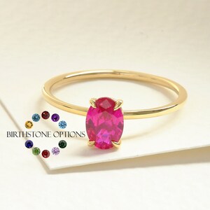 Oval Ruby Ring – 14K Solid Gold ❤️✨
This elegant oval ruby birthstone ring is crafted in solid gold and designed with a timeless solitaire setting. The rich red gemstone brings warmth, passion, and meaning to any look. Its slim, stackable band makes it perfect for daily wear—either on its own or paired with your favorite rings. A delicate and feminine piece for women who love classic ruby jewelry.
