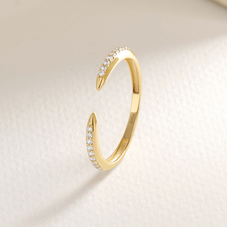 Here's the 14k Gold Small Diamond Spike Stacking Ring by Christo! Our Pave Tiny Moissanite Minimalist Open Cuff Adjustable Band is perfect Stackable and Daily Wear Ring for Girls. Solid Gold Crescent Moon Ring is designed as Index Finger Ring