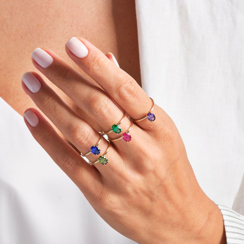 Oval Ruby Ring – 14K Solid Gold ❤️✨
This elegant oval ruby birthstone ring is crafted in solid gold and designed with a timeless solitaire setting. The rich red gemstone brings warmth, passion, and meaning to any look. Its slim, stackable band makes it perfect for daily wear—either on its own or paired with your favorite rings. A delicate and feminine piece for women who love classic ruby jewelry.