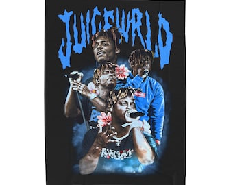May include: Black and blue graphic print of rapper Juice WRLD on a black t-shirt. The print features multiple images of Juice WRLD with flowers and the text "999" in white.