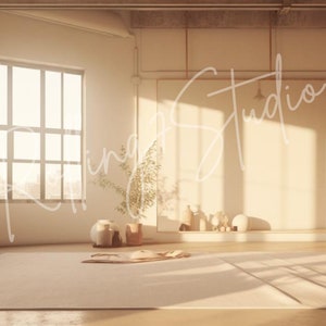May include: A white, minimalist studio space with large windows, a white wall, and a wooden floor. The space is decorated with potted plants and a white ceramic vase on a wooden stool. The studio is bathed in warm, natural light.