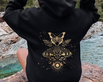 May include: Black hooded sweatshirt with a gold butterfly and moon design on the back.