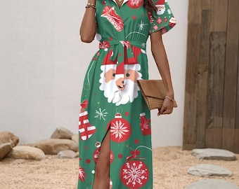 May include: Green Christmas-themed dress featuring a Santa Claus face, ornaments, and snowflakes. The dress has a white collar, short sleeves, and a tie waist. The dress has a slit on the side and is paired with a brown clutch.