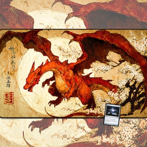 May include: A rectangular playmat featuring a red dragon with large wings, set against a backdrop of a full moon and cherry blossoms. The dragon is the central focus, with Japanese text and a small card in the corner.