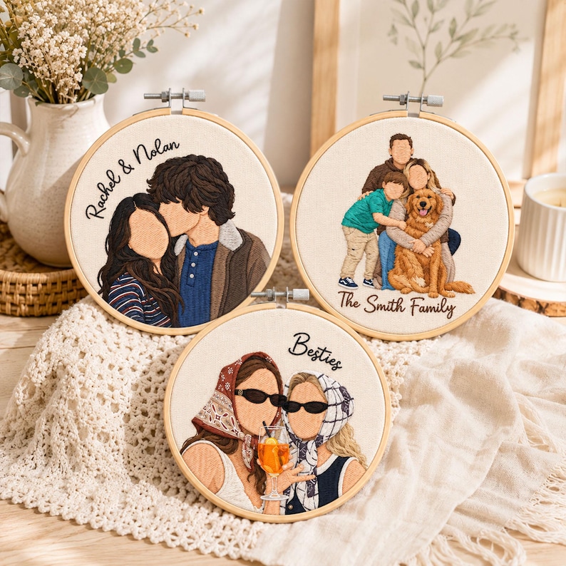 May include: Three circular embroidery hoops featuring custom thread portraits on off-white fabric. One shows a couple with the text Rachel & Nolan, another a family with a dog labeled The Smith Family, and the third two people labeled Besties.