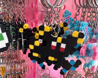 Dark black and yellow pocket pet keychain perler bead pixel art original coloring
