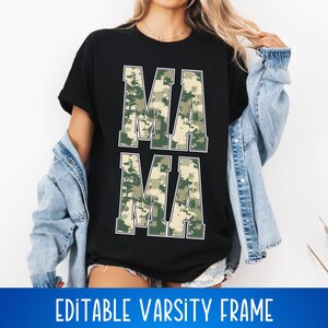 May include: A black t-shirt with the word "MAMA" printed in white letters. The letters are filled with a camouflage pattern in shades of green and brown. The t-shirt is being worn by a person.