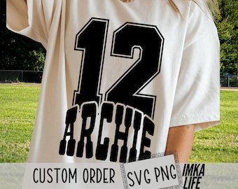 May include: Cream-colored t-shirt featuring the number 12 in black with a white outline, and the name "ARCHIE" below. The words "CUSTOM ORDER" and "SVG PNG IMKA LIFE" are also visible.