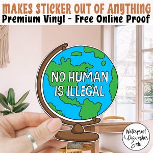 Può includere: Un adesivo a forma di globo con le parole "NO HUMAN IS ILLEGAL" in bianco su sfondo blu e verde. L'adesivo è tenuto in mano. Il testo "MAKES STICKER OUT OF ANYTHING" è in alto. L'adesivo è impermeabile.