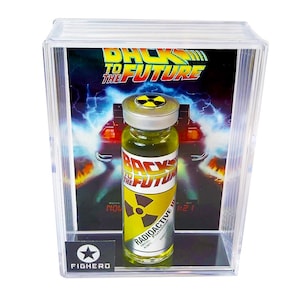 May include: A clear display case featuring a "Back to the Future" themed radioactive plutonium vial. The vial has a yellow liquid and a radioactive symbol. The background shows the movie's logo and a DeLorean.