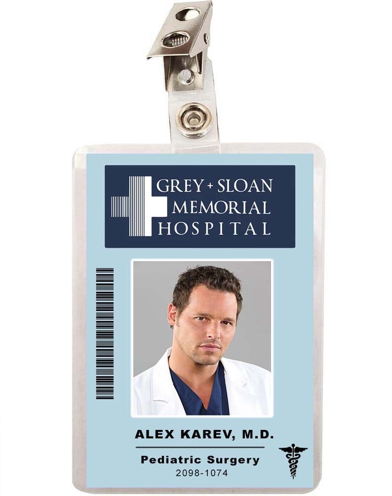 May include: A blue and white plastic ID badge with a photo of a man in a white coat. The badge reads "GREY + SLOAN MEMORIAL HOSPITAL" and "ALEX KAREV, M.D. Pediatric Surgery 2098-1074".