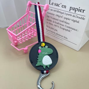 Leuke Dinasour intrekbare hanger autohaak, autostoelhaak, babywagen universele haak, haak voor tas, auto-interieur