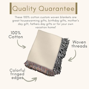 May include: A folded cream-colored blanket with colorful fringed edges and woven threads. The blanket is made of 100% cotton. Text reads "Quality Guarantee".