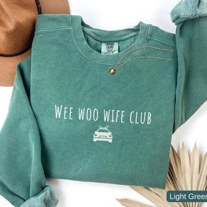 Police wife sweatshirt Wee Woo Wife Club Comfort Colors law enforcement spouse

Cop wife crewneck sweatshirt police family support shirt

Law enforcement wife sweatshirt casual everyday wear

Wee Woo Wife Club police spouse gift Comfort Colors

Police wife apparel cozy cop wife sweatshirt