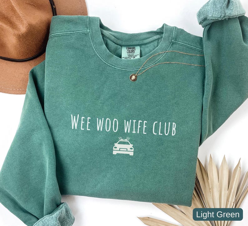Police wife sweatshirt Wee Woo Wife Club Comfort Colors law enforcement spouse

Cop wife crewneck sweatshirt police family support shirt

Law enforcement wife sweatshirt casual everyday wear

Wee Woo Wife Club police spouse gift Comfort Colors

Police wife apparel cozy cop wife sweatshirt