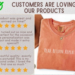 May include: An orange Comfort Colors t-shirt with the text "READ. RETURN. REPEAT." is displayed. A gold necklace with a pendant rests on the shirt. The image also includes customer reviews with five-star ratings.