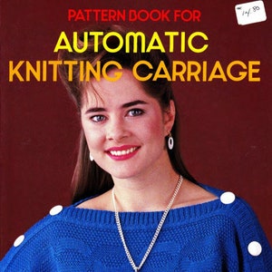 May include: A woman wearing a blue knit sweater with white buttons on the shoulders and sleeves. She is wearing a silver necklace with a black and silver pendant and white earrings. The image has text that reads "PATTERN BOOK FOR AUTOMATIC KNITTING CARRIAGE".