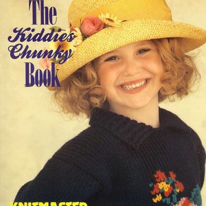 May include: A young girl wearing a blue knitted sweater with a floral design and a yellow straw hat with pink and yellow flowers. The book cover reads "The Kiddies Chunky Book" and "Knitmaster creative kone chunky".