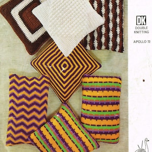 May include: A collection of six colorful knitted pillow covers with various patterns, including stripes, zigzags, and squares. The covers are made with a double knitting technique and are available in shades of brown, white, purple, yellow, and green. The image also includes the text "6570 Emu DK Double Knitting Apollo 72 9p".