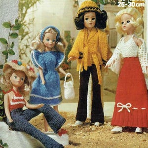 May include: Four knitted doll outfits in different colors and styles. The outfits include a blue dress, a yellow jacket with brown pants, a red skirt with a white top, and a red and white top with blue jeans. The dolls are not included.