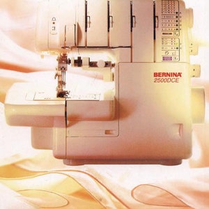 May include: A white Bernina 2500DCE serger sewing machine with a variety of stitch options. The machine is sitting on a light pink fabric.