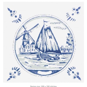 Puede incluir: Diseño de punto de cruz azul y blanco con un velero, un molino de viento y edificios dentro de un marco circular. Acentos florales decorativos en cada esquina. El texto en la parte inferior dice: Design size: 200 x 200 stitches.