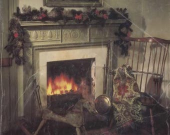 May include: A vintage Sears Wish Book cover featuring a cozy fireplace with a roaring fire, a rocking horse, and a rocking chair with a blanket. The text on the cover reads "1983 Wish Book" and "There's more for your life at Sears".
