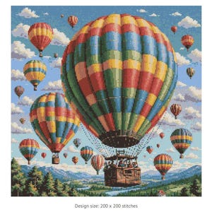 May include: A colorful hot air balloon with a basket full of people floats in a blue sky with white clouds. Other hot air balloons are in the background.